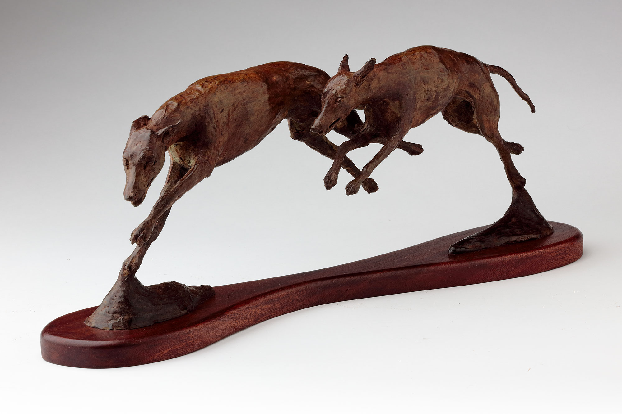 Bronze sculpture running whippets