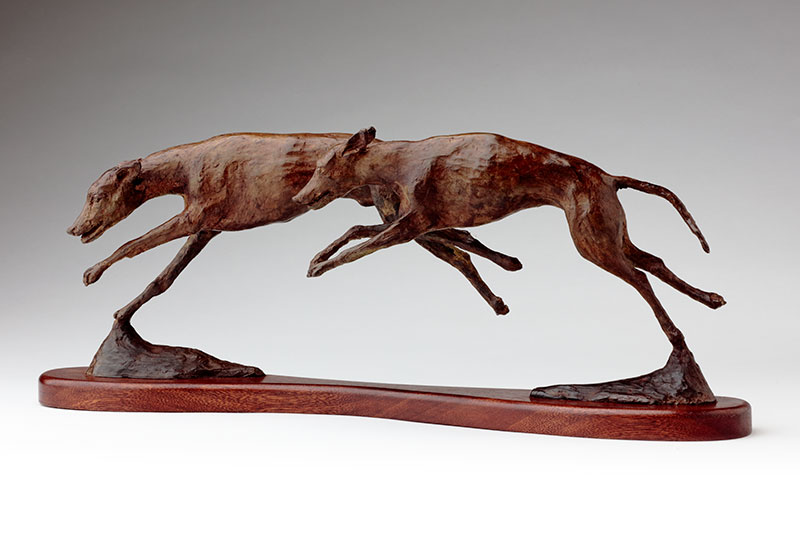 Bronze sculpture running whippets