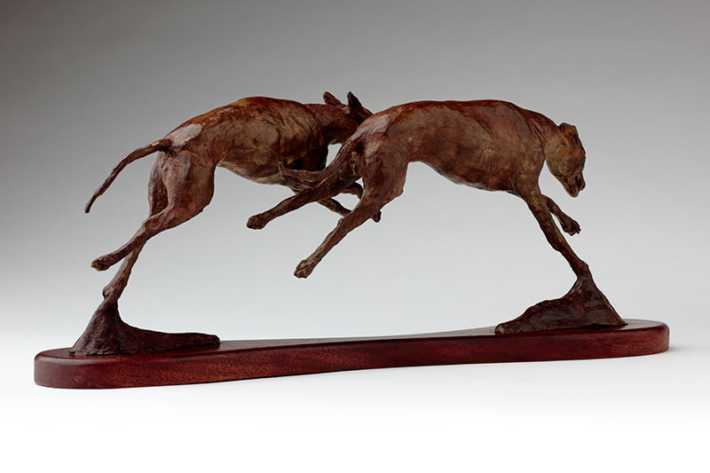 bronze sculpture running whippets