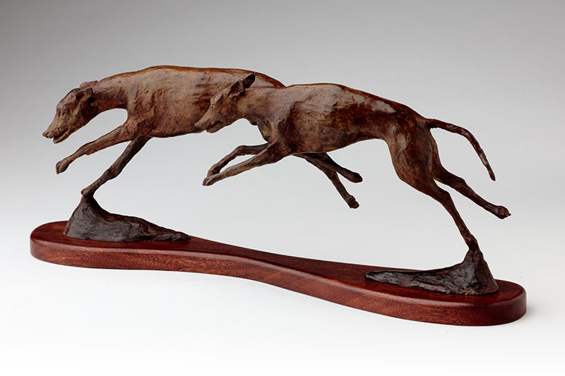 bronze sculpture running whippets