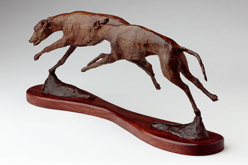 bronze sculpture running whippets